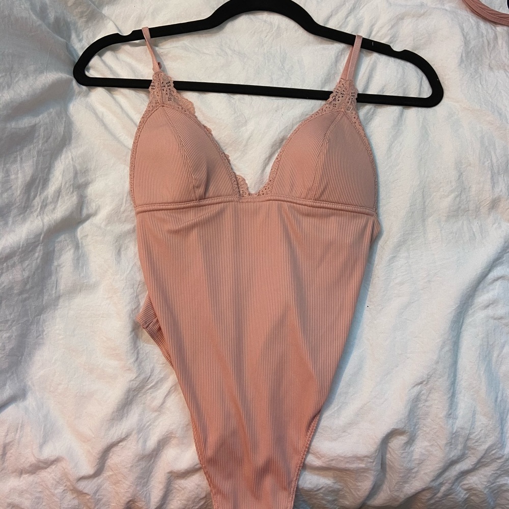 Pink lacey bodysuit